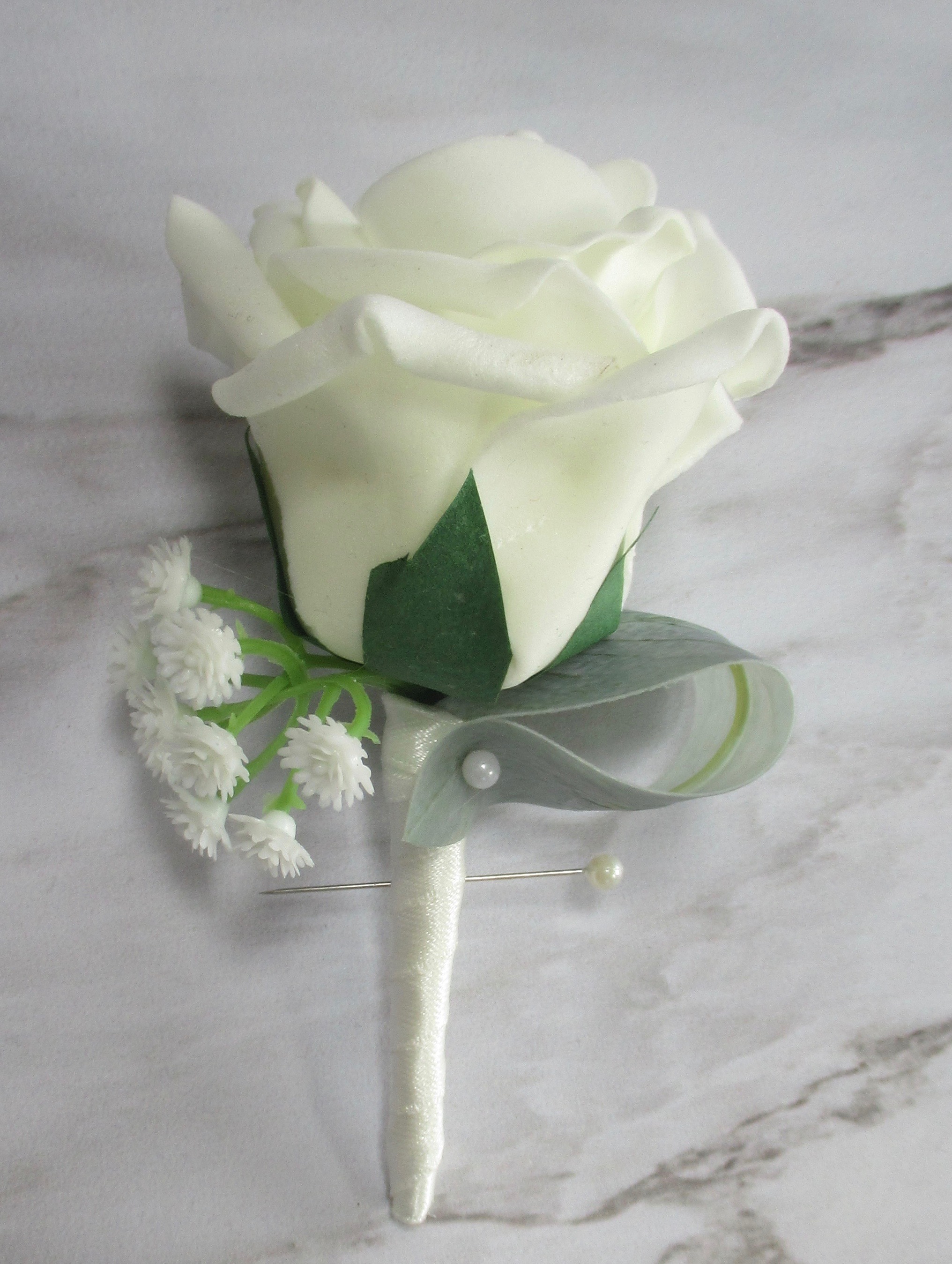 ivory rose and gyp buttonhole 